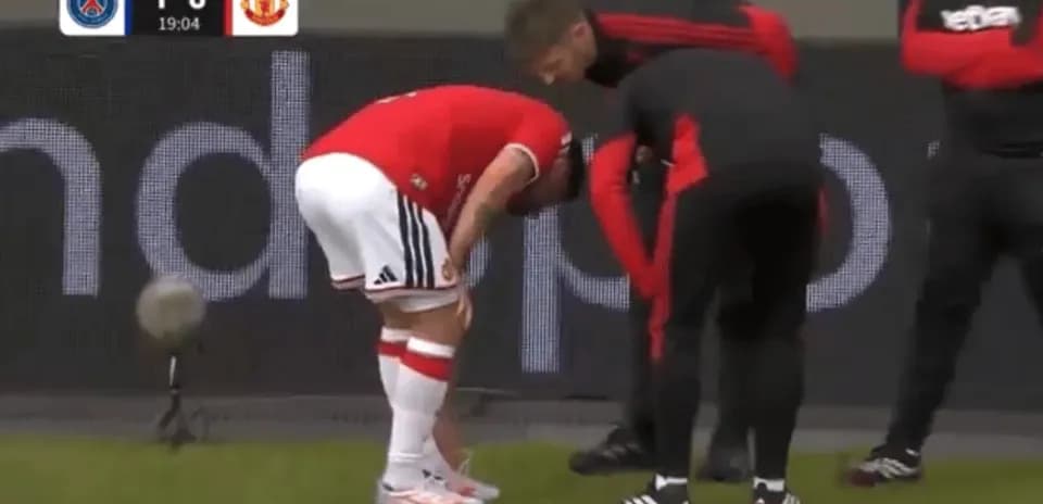 Player receiving medical attention on the sideline