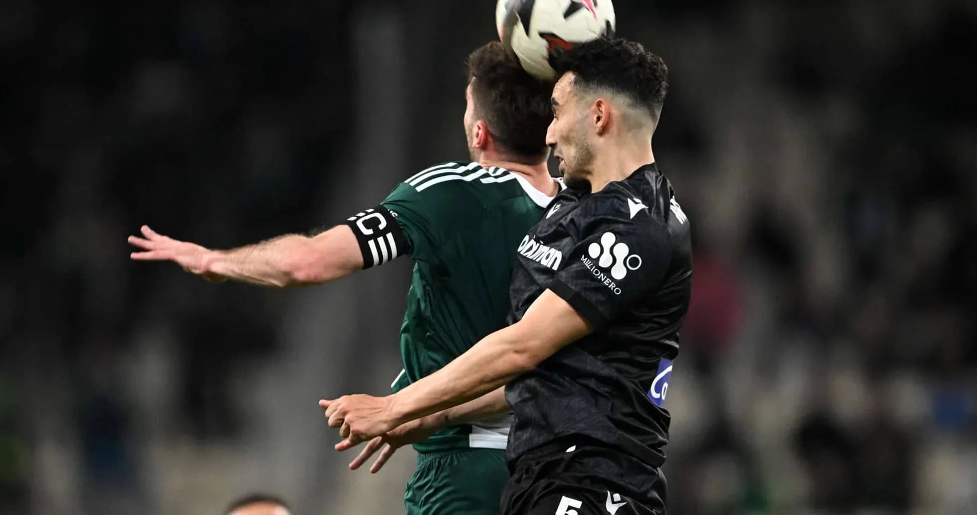 Players competing for the ball in Super League match