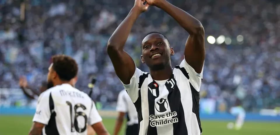 Player celebrating with teammates after match victory