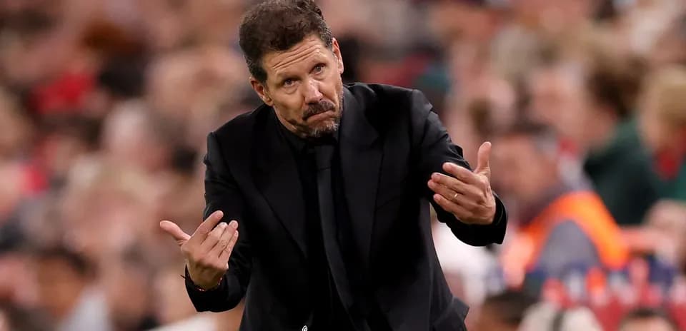 Manager gesturing during match on the sidelines