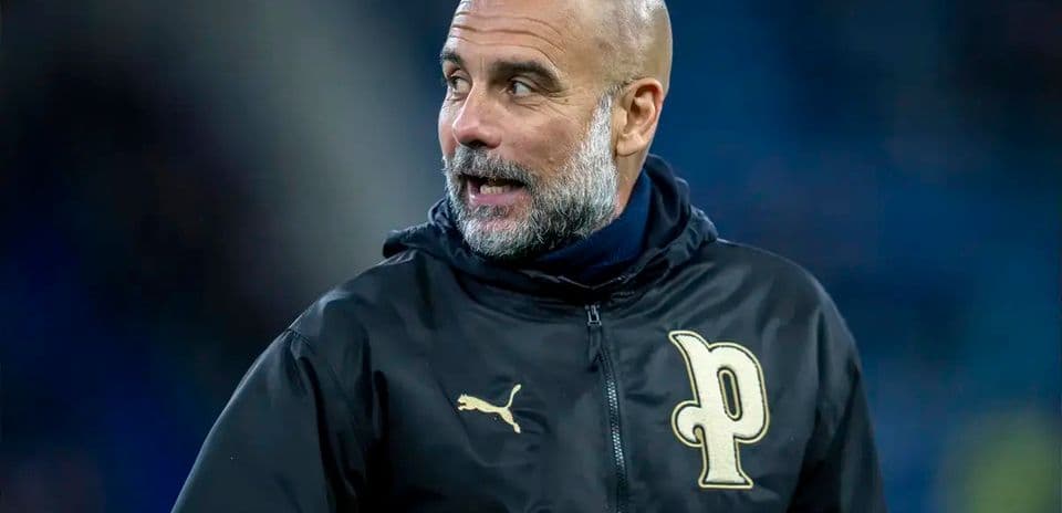 Coach wearing Puma jacket during match warm-up
