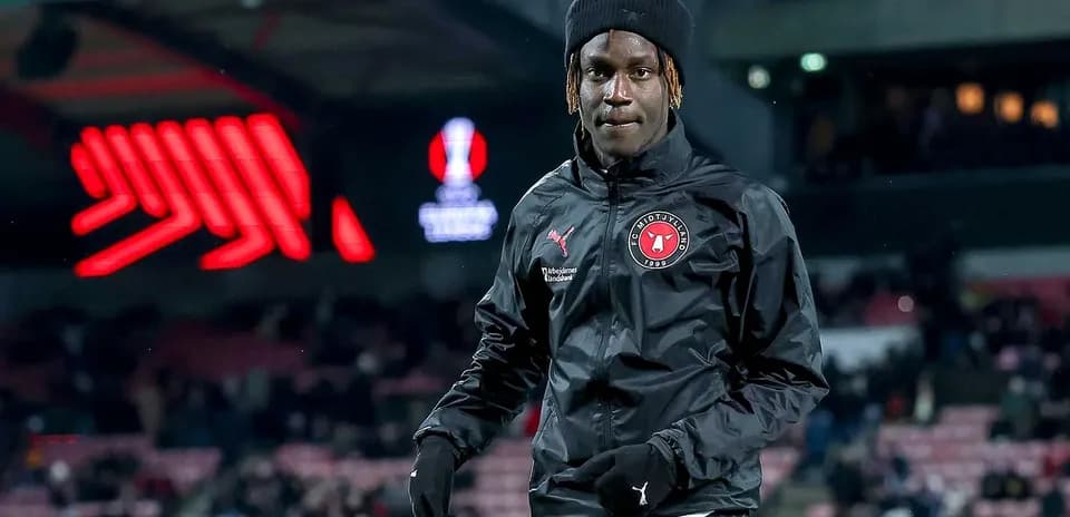 Player in FC Midtjylland jacket on the pitch