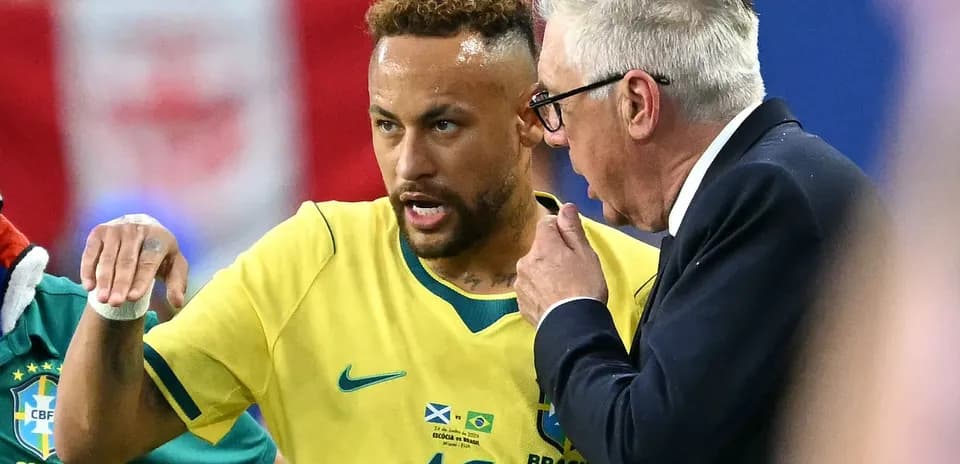 Neymar discussing strategy with coach during match