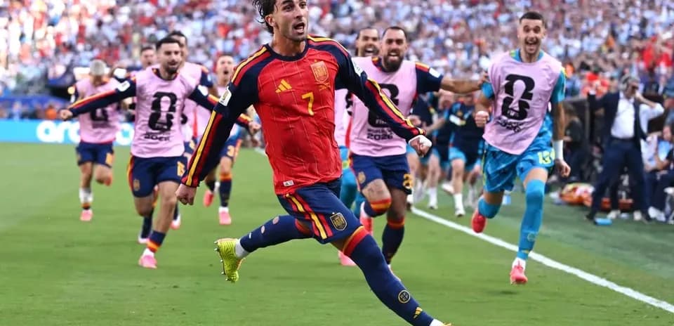 Player celebrating a goal with teammates during match