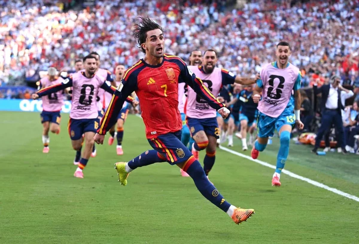 Player celebrating a goal with teammates during match
