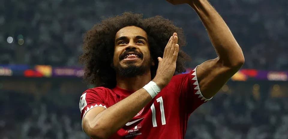 Qatar player celebrating during football match