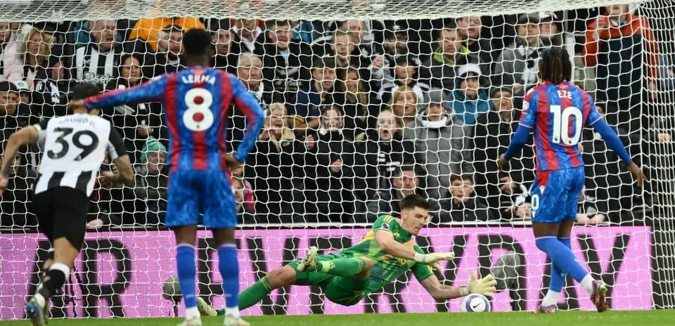 Goalkeeper saving a penalty during match