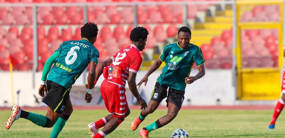 Players competing for the ball on the field
