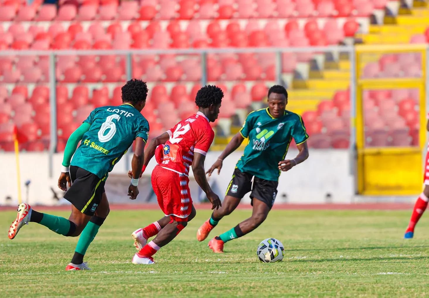 Players competing for the ball on the field