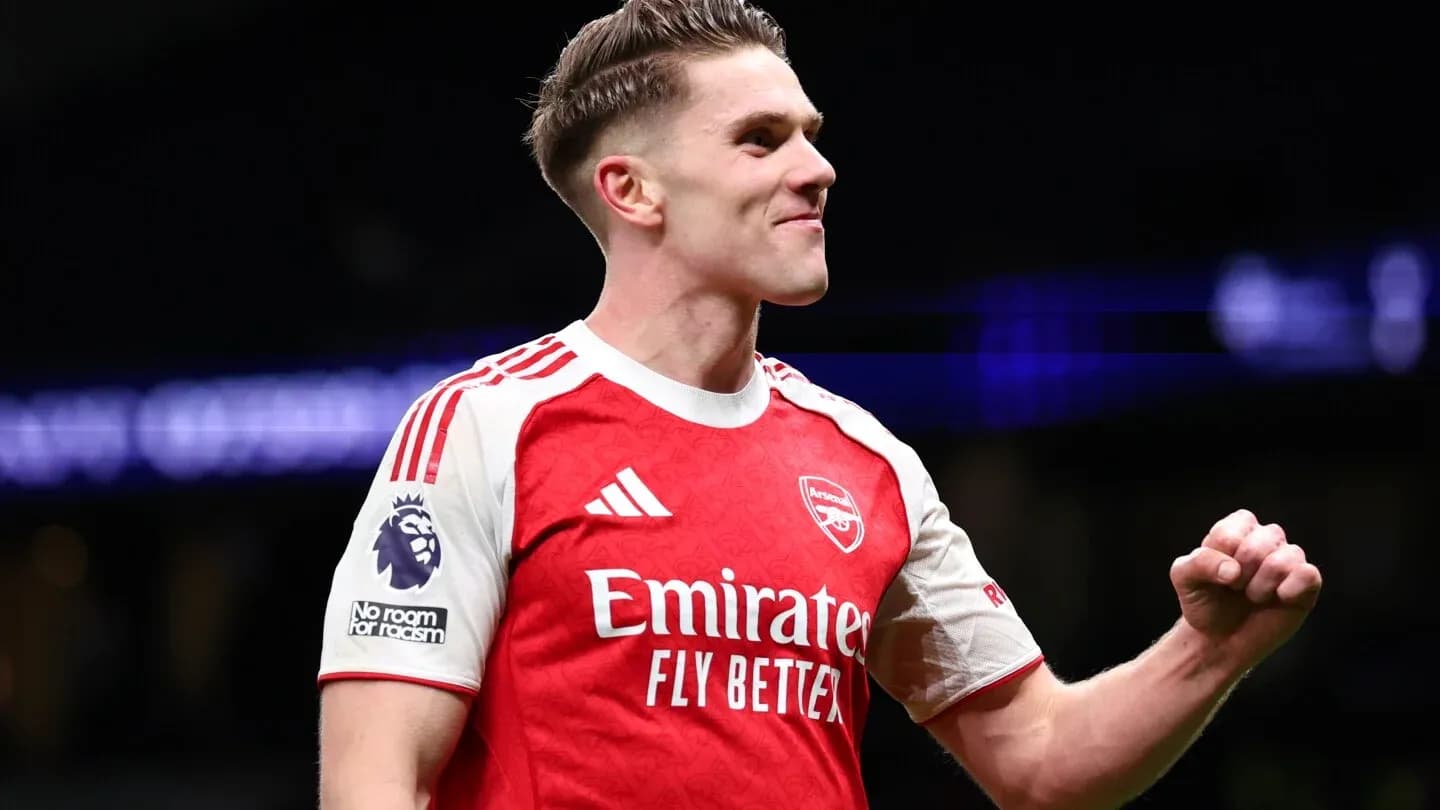 Player celebrating in Arsenal jersey during match