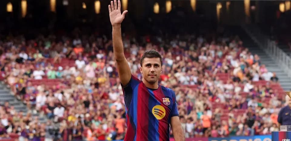 Player waving to fans at stadium event