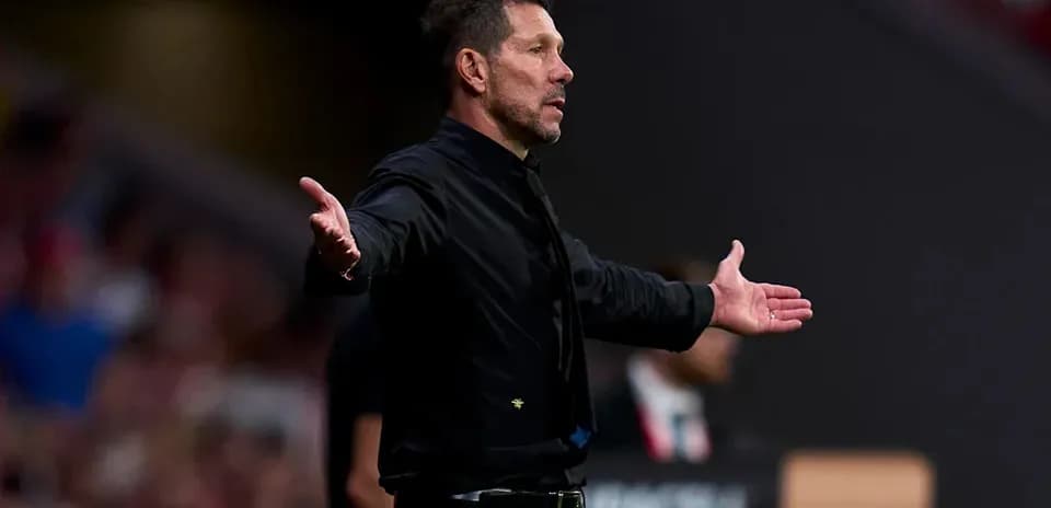 Coach gesturing during a match on the sidelines