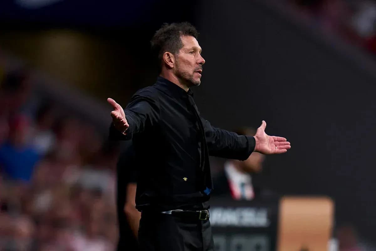 Coach gesturing during a match on the sidelines