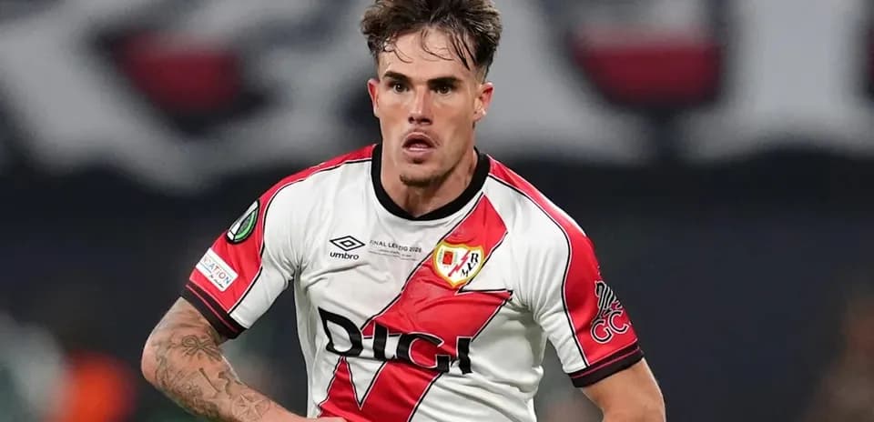 Player in action wearing Rayo Vallecano jersey