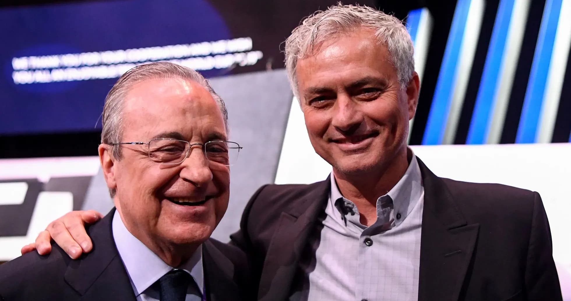 Two men posing together at an event