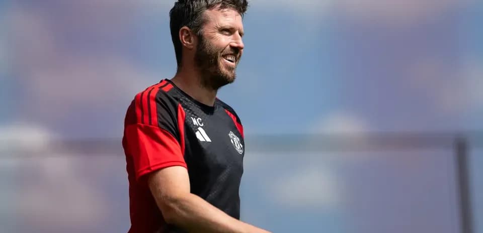 Coach walking during training session in sunny weather
