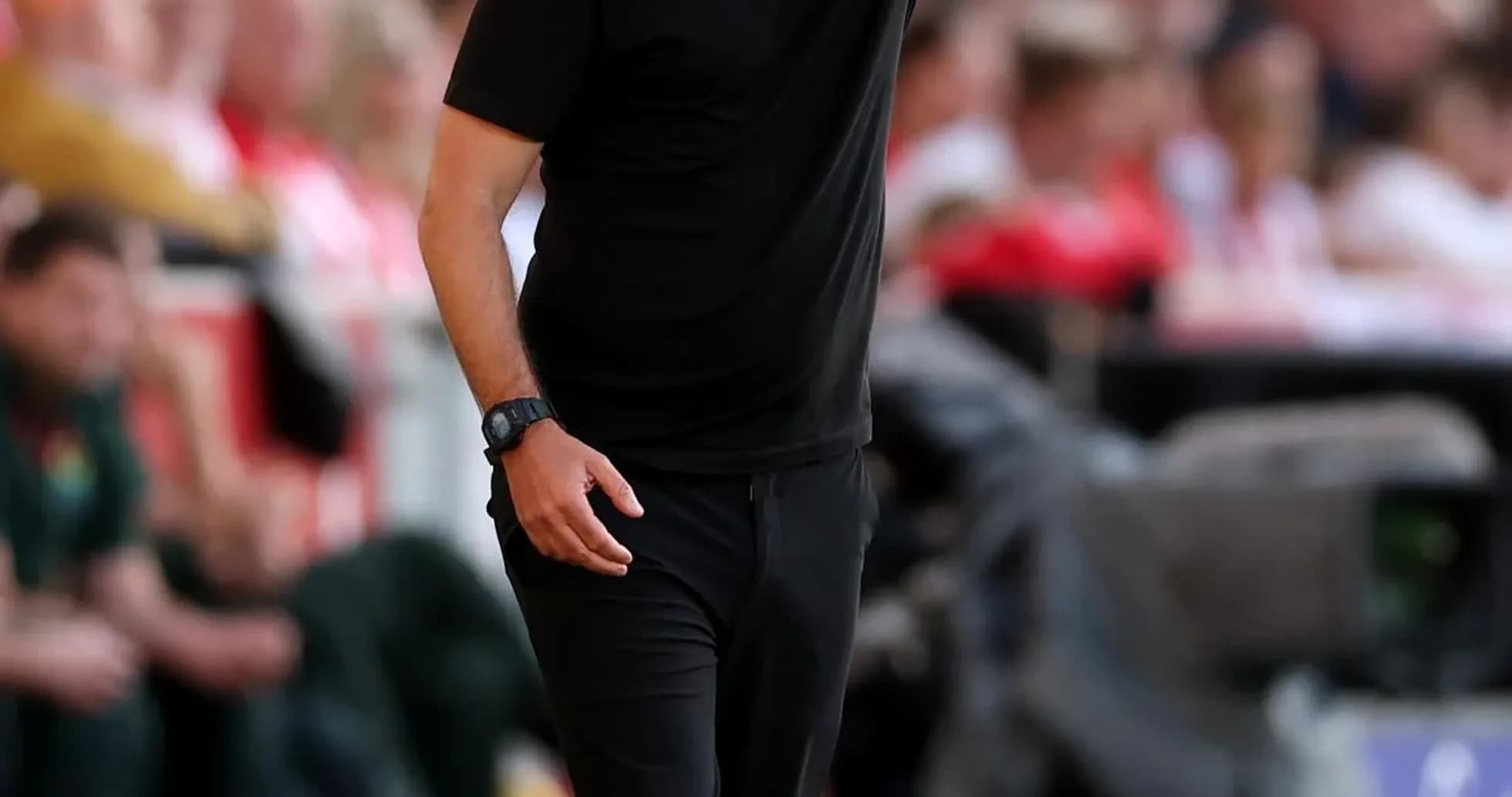 Coach giving instructions from the sideline during match