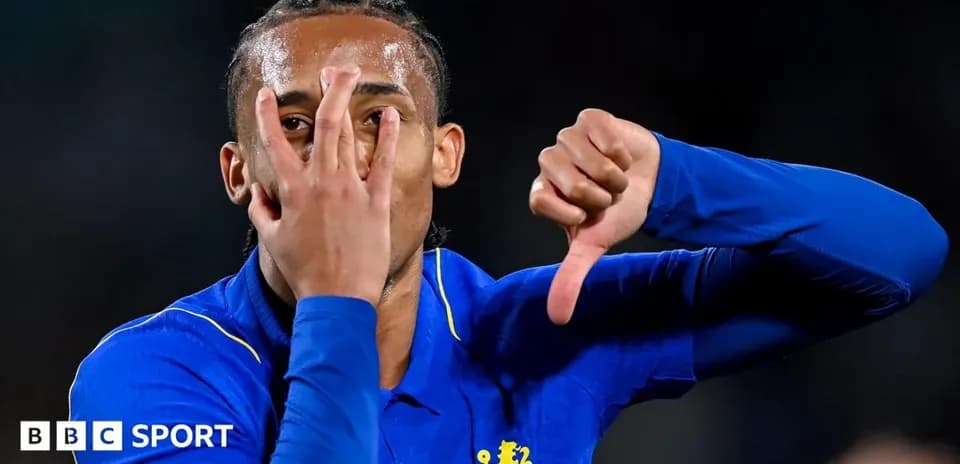 Player gesturing with hand during match celebration