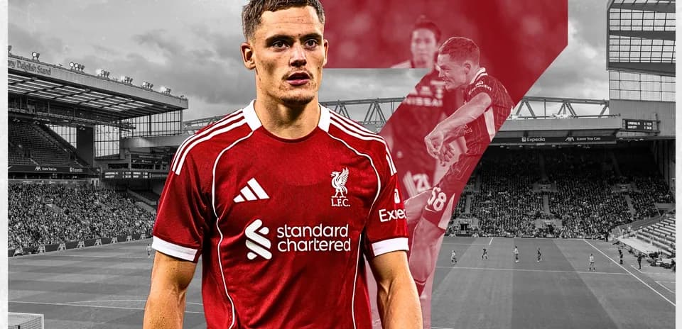 Liverpool player in home kit at Anfield stadium