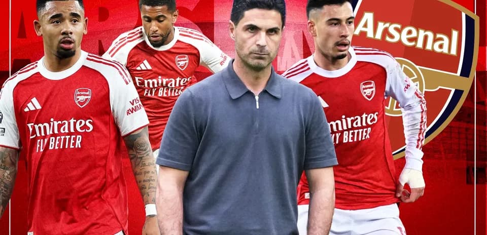 Arsenal players and manager in team attire