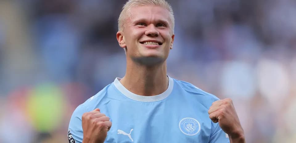 Player celebrating after scoring a goal for Manchester City