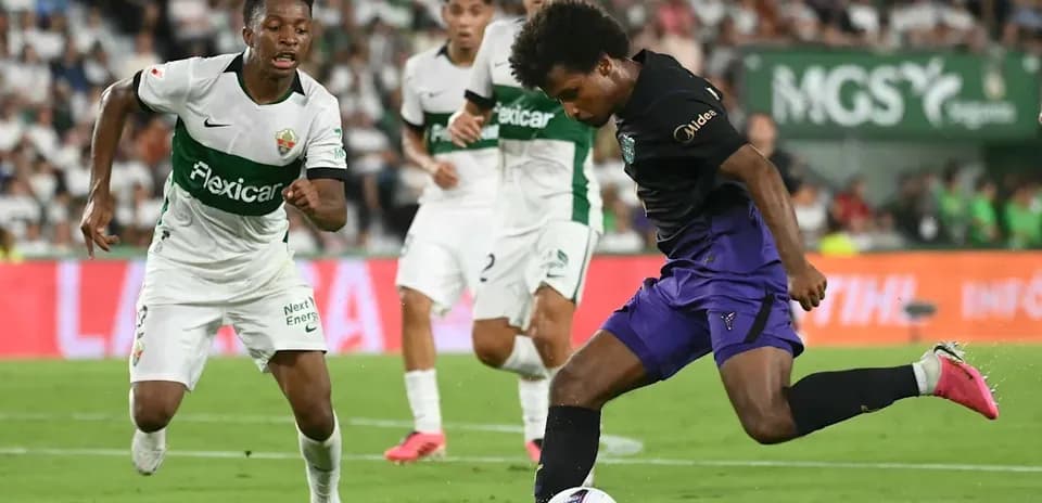 Player dribbling the ball during a soccer match