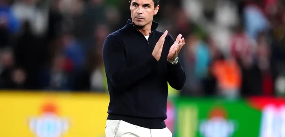 Coach applauding during match at stadium