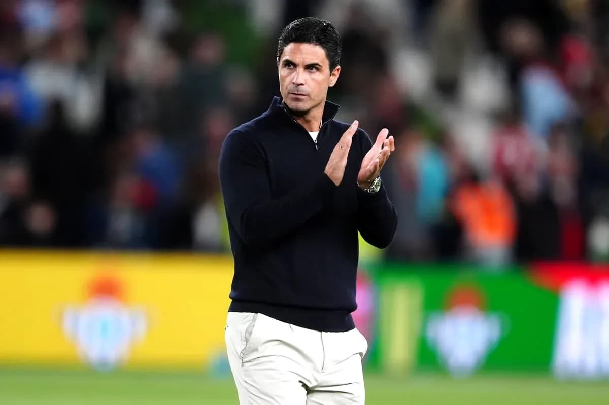 Coach applauding during match at stadium