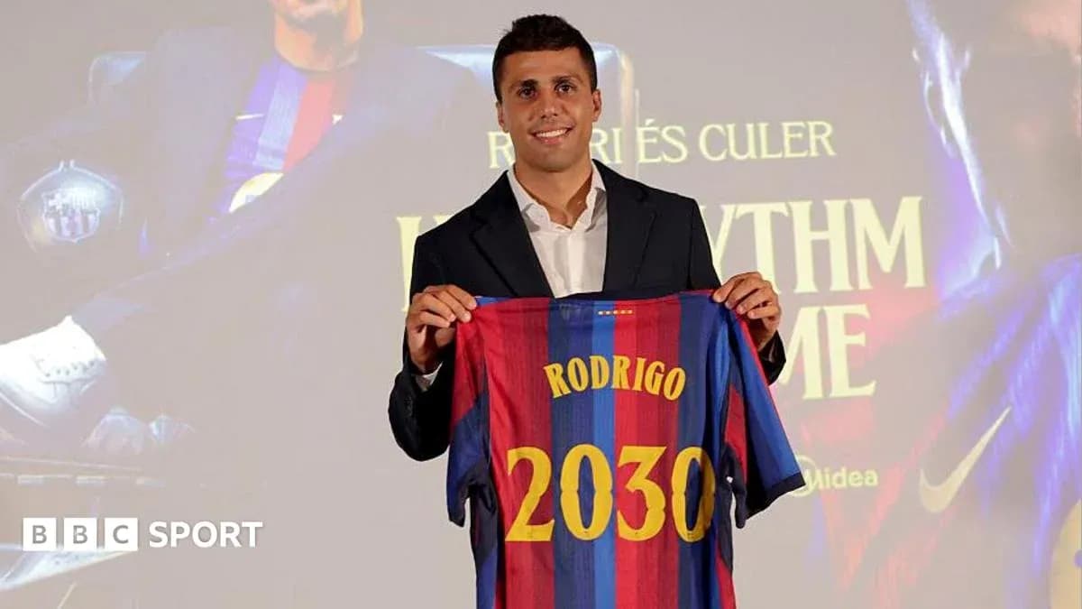 Player holding Barcelona jersey at presentation event