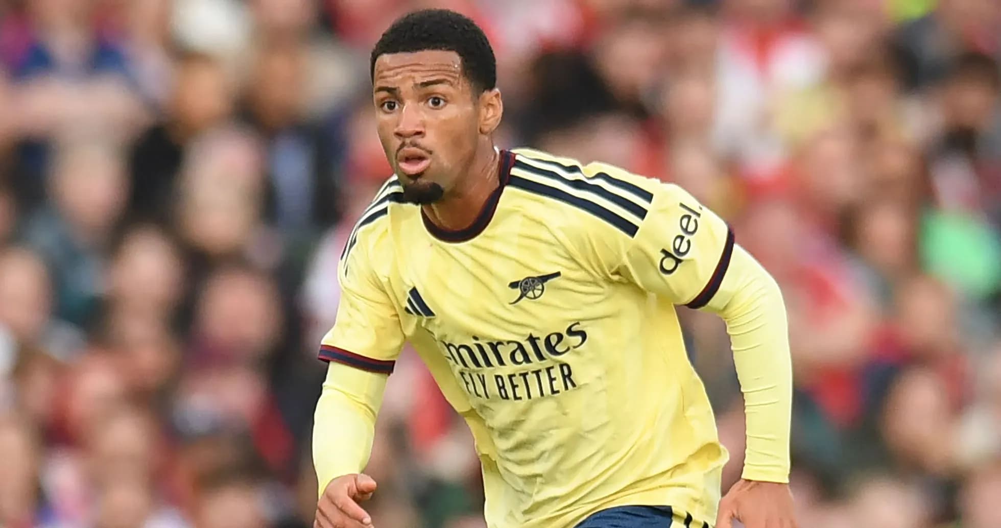 Player in Arsenal jersey running during match