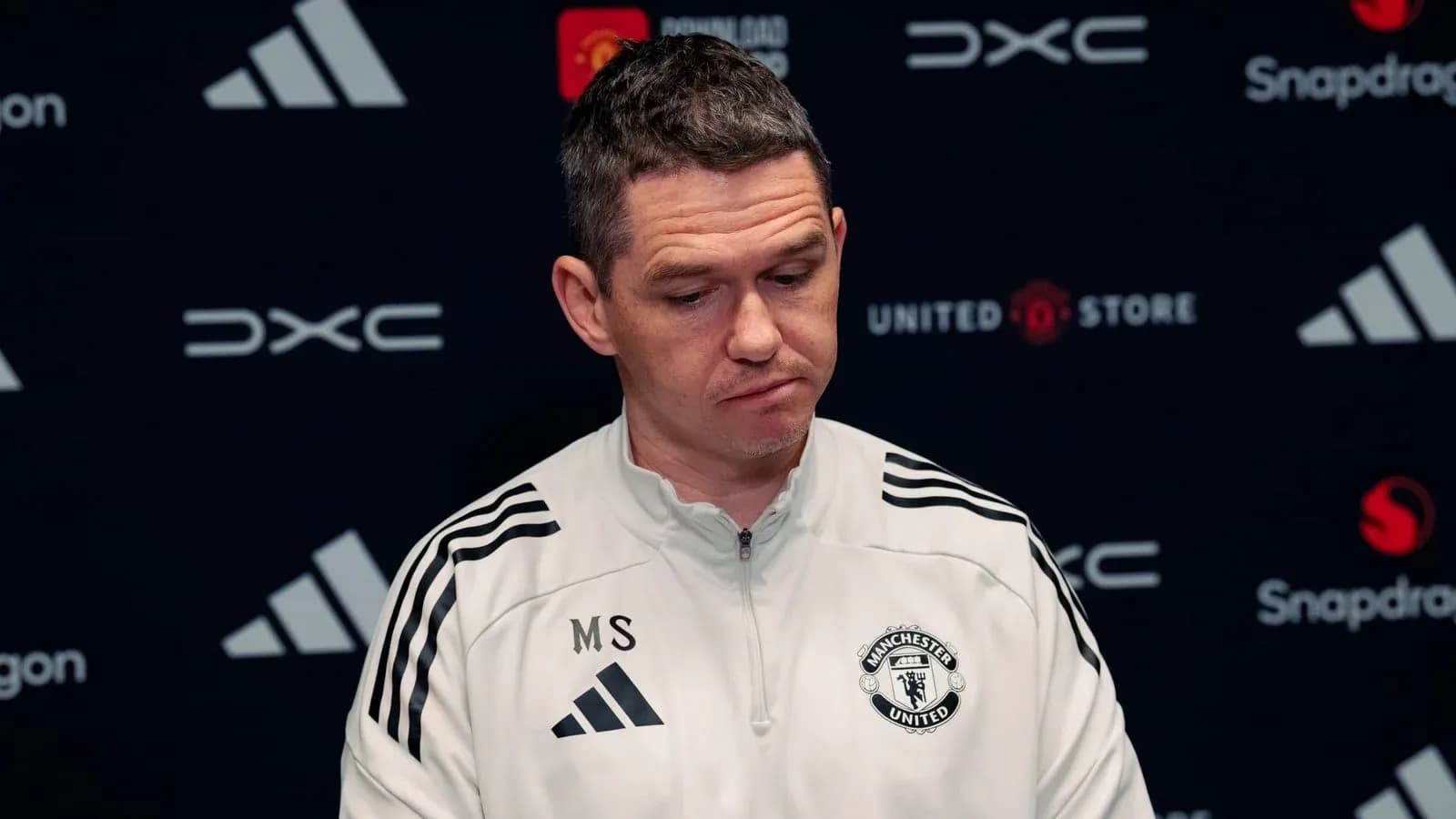 Manchester United manager at press conference podium
