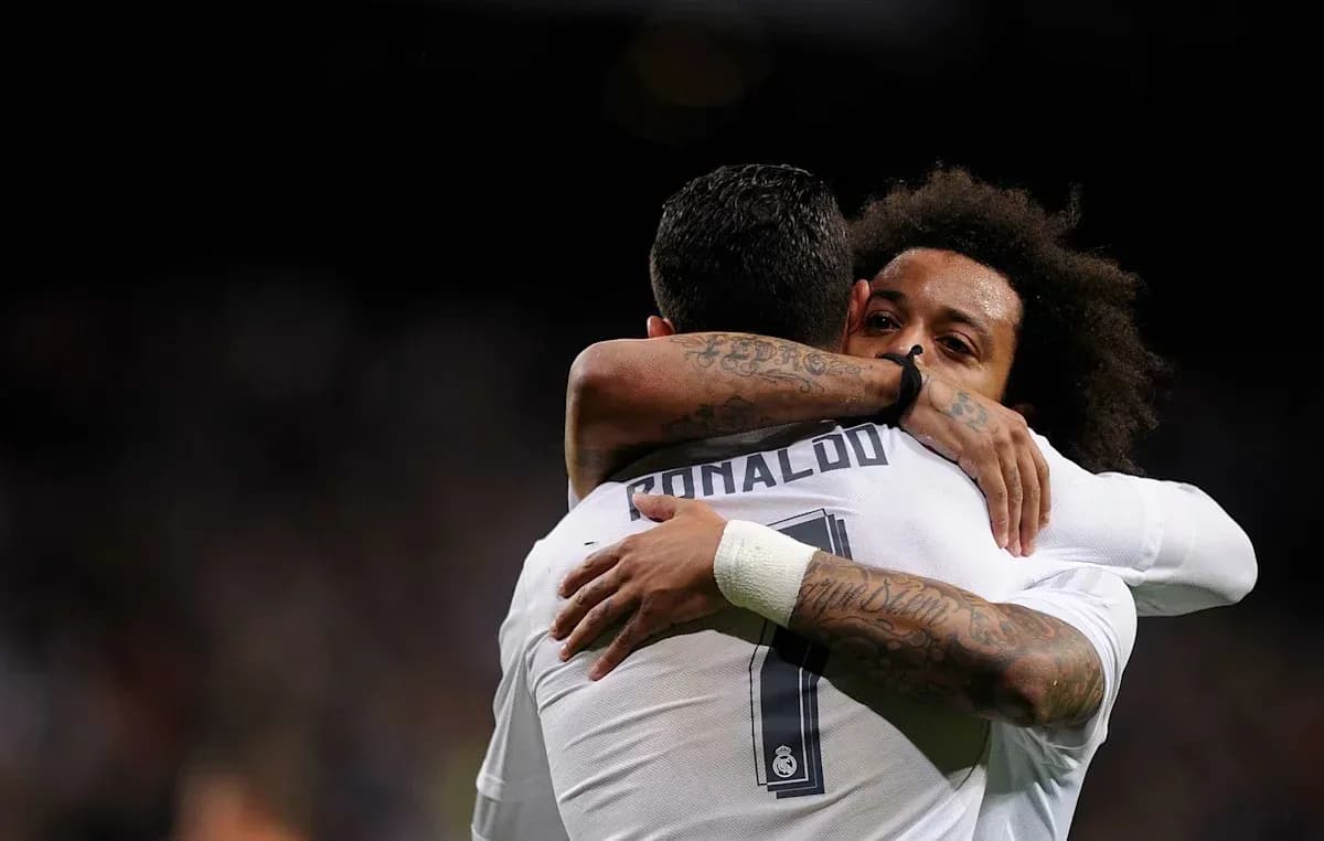 Cristiano Ronaldo and Marcelo embracing on field