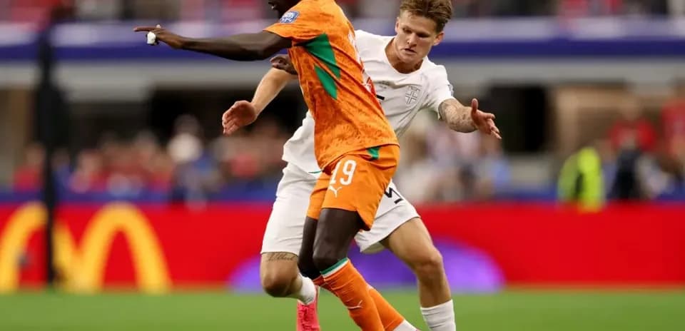 Two players competing for the ball during match