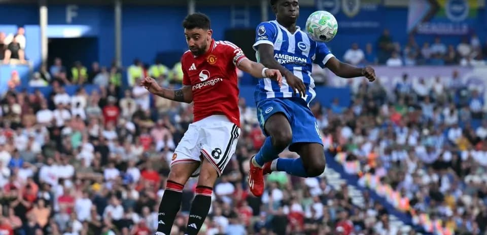 Player heading the ball during a football match