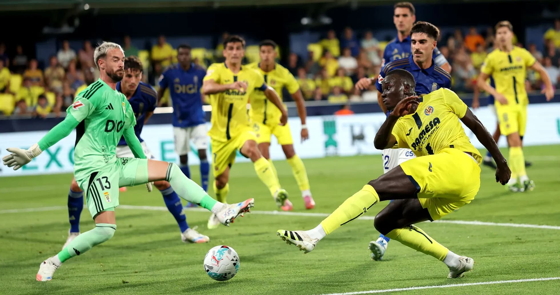 Villarreal player attempting to score against Oviedo