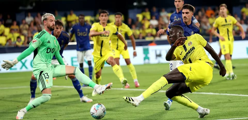 Villarreal player attempting to score against Oviedo