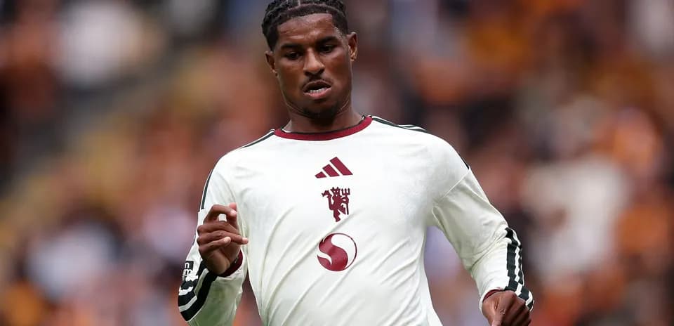 Player running on field in team jersey