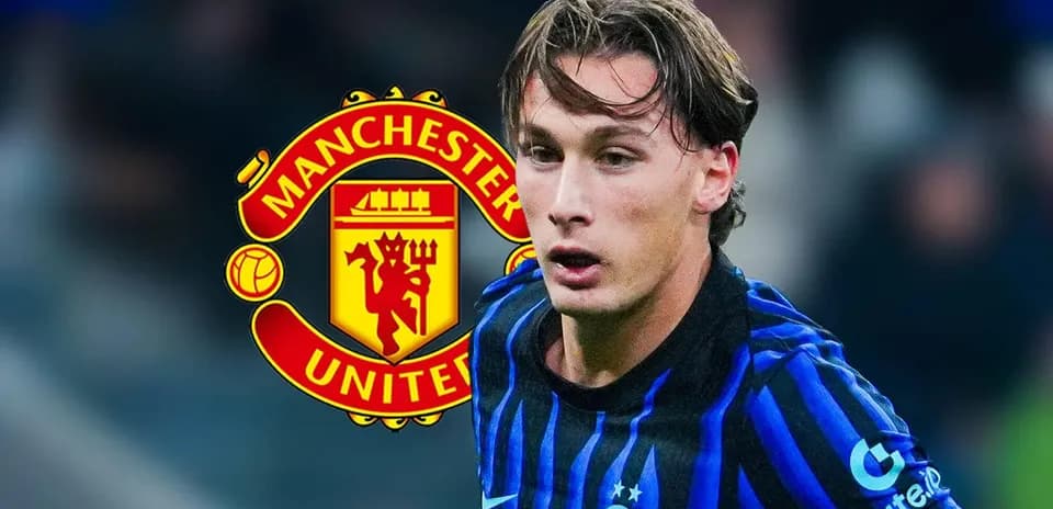 Player running with ball, Manchester United logo behind
