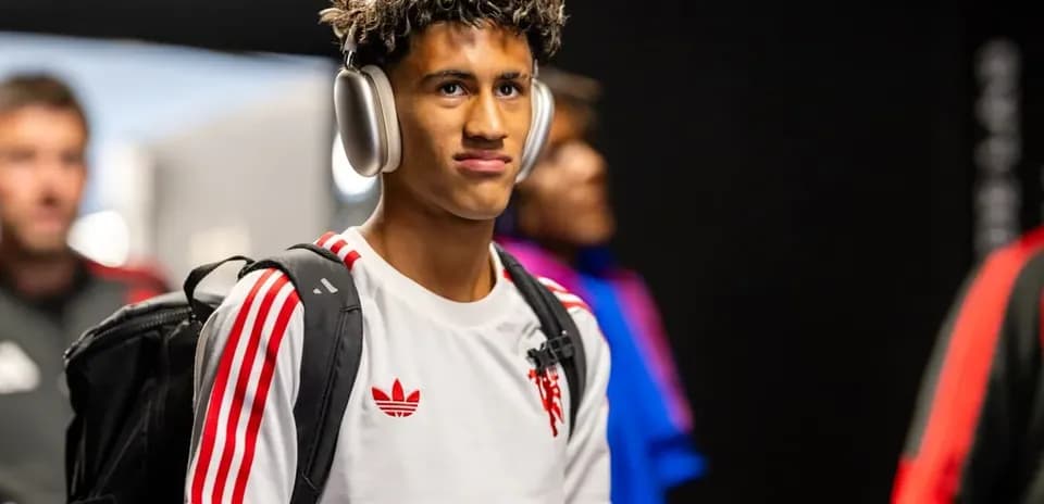 Player wearing headphones entering the stadium