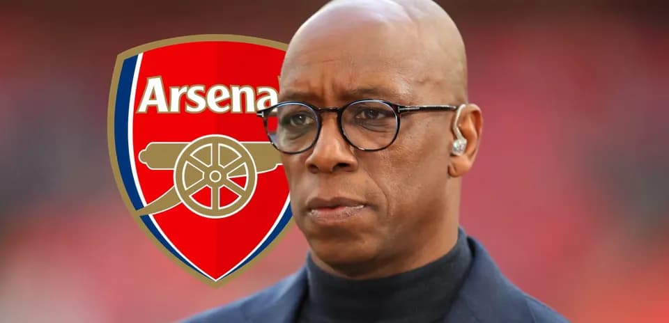 Man in glasses with Arsenal logo in background
