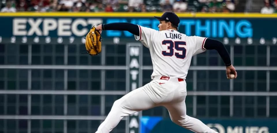 Pitcher Long delivering a pitch on the mound