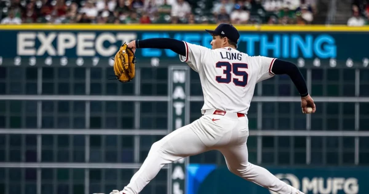 Pitcher Long delivering a pitch on the mound