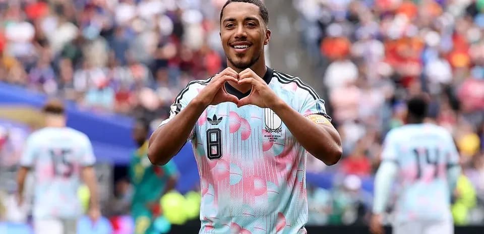 Player celebrating and making heart gesture after goal