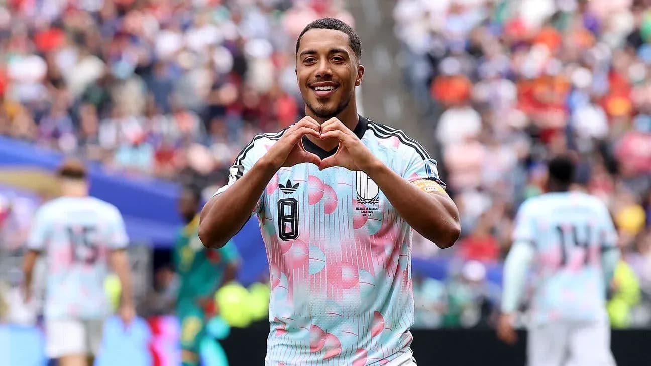 Player celebrating and making heart gesture after goal