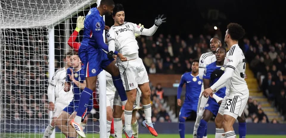 Chelsea player attempting to score against Fulham