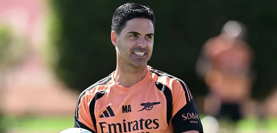 Manager holding a ball during training session