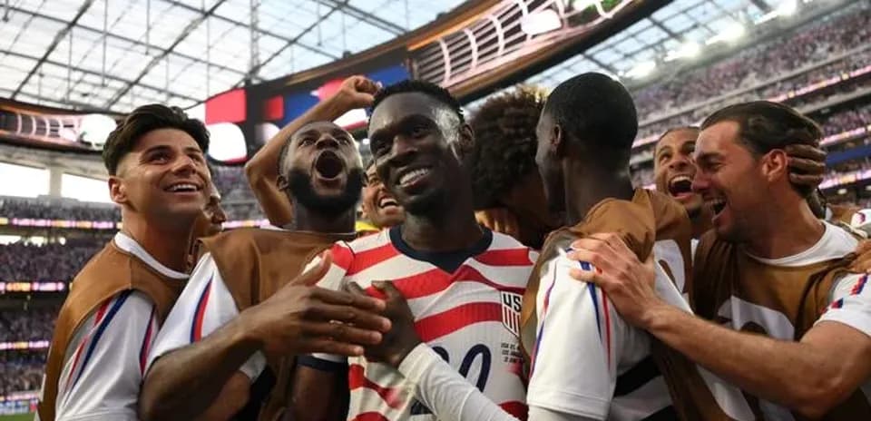 US players celebrating a goal during match