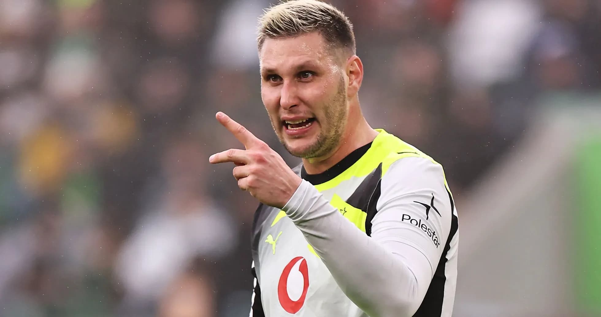 Goalkeeper gesturing during a match on field