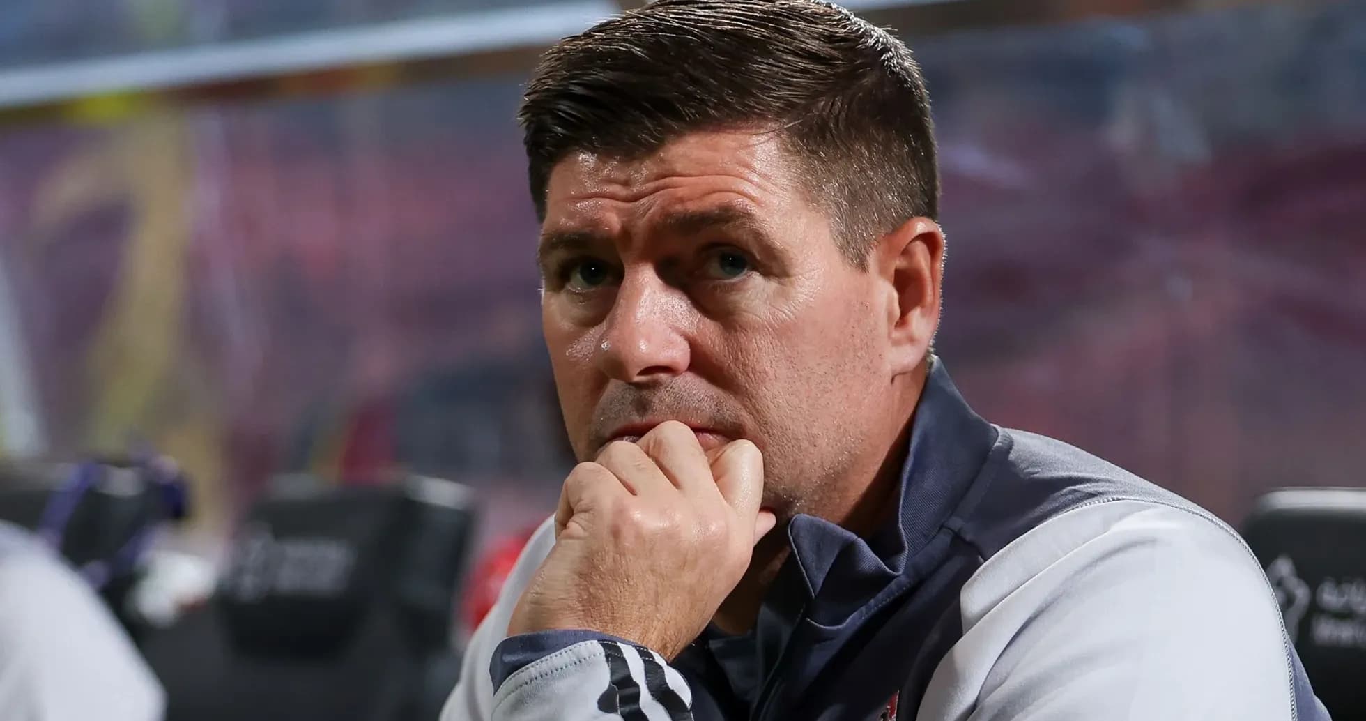 Coach observing from the sidelines during match