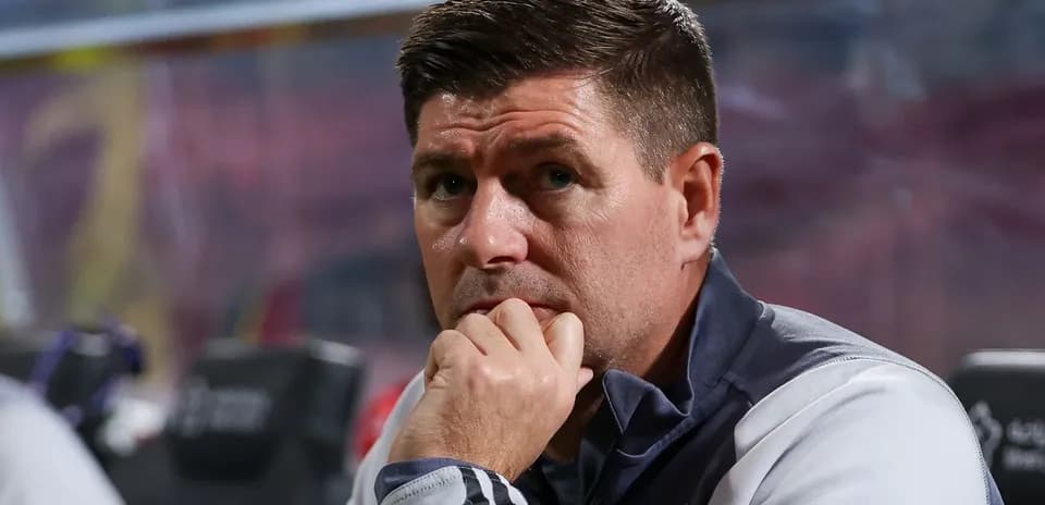 Coach observing from the sidelines during match